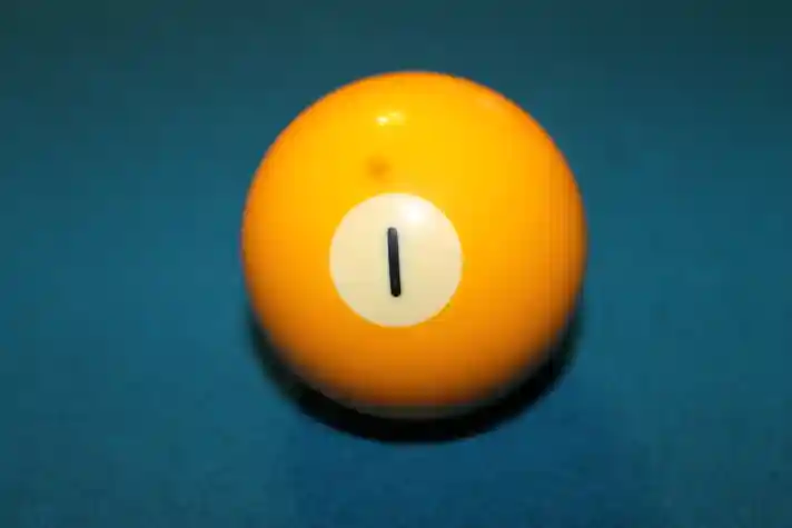 Yellow number one billiard ball