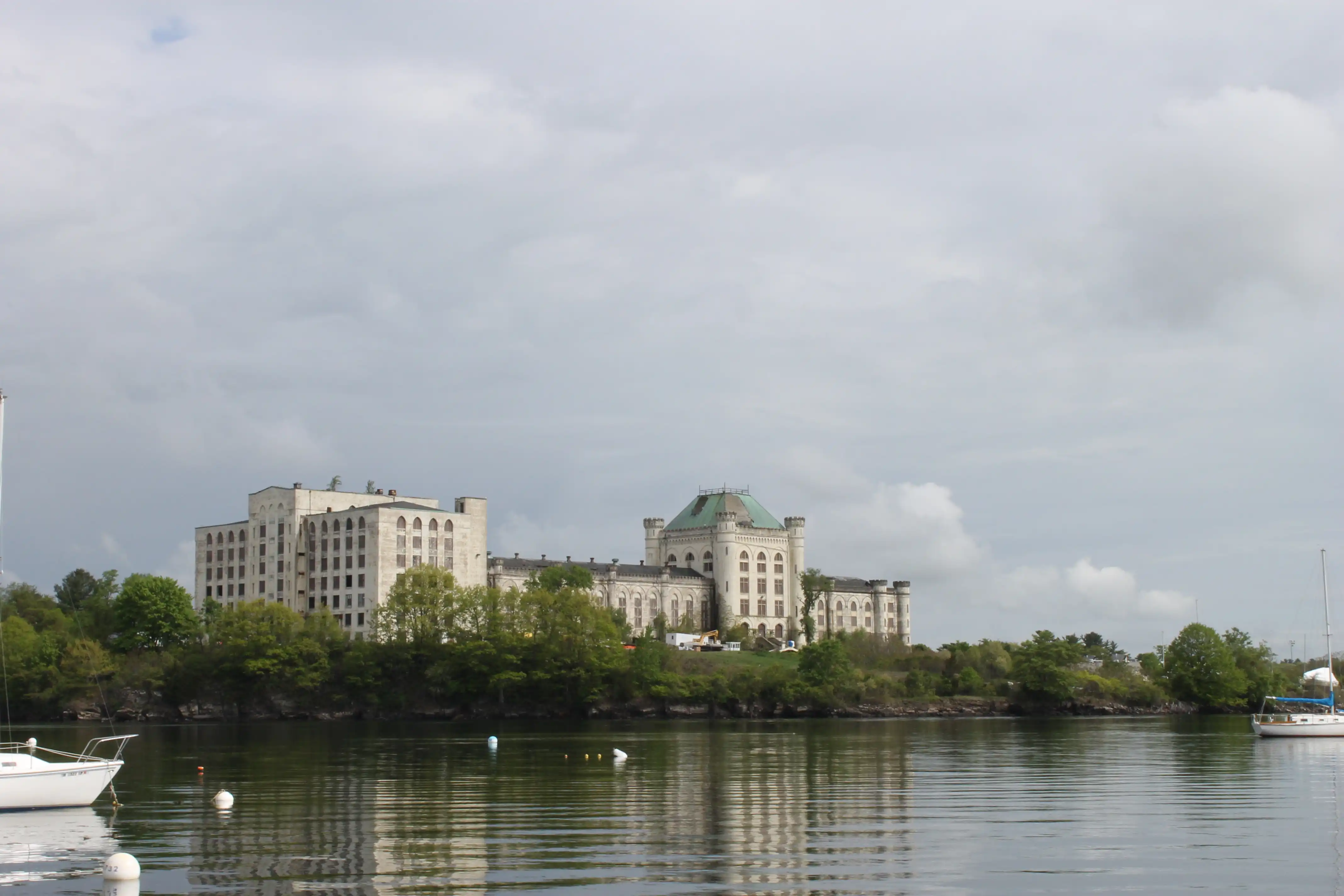 An old building on an island shot from a boat in the surrounding waters