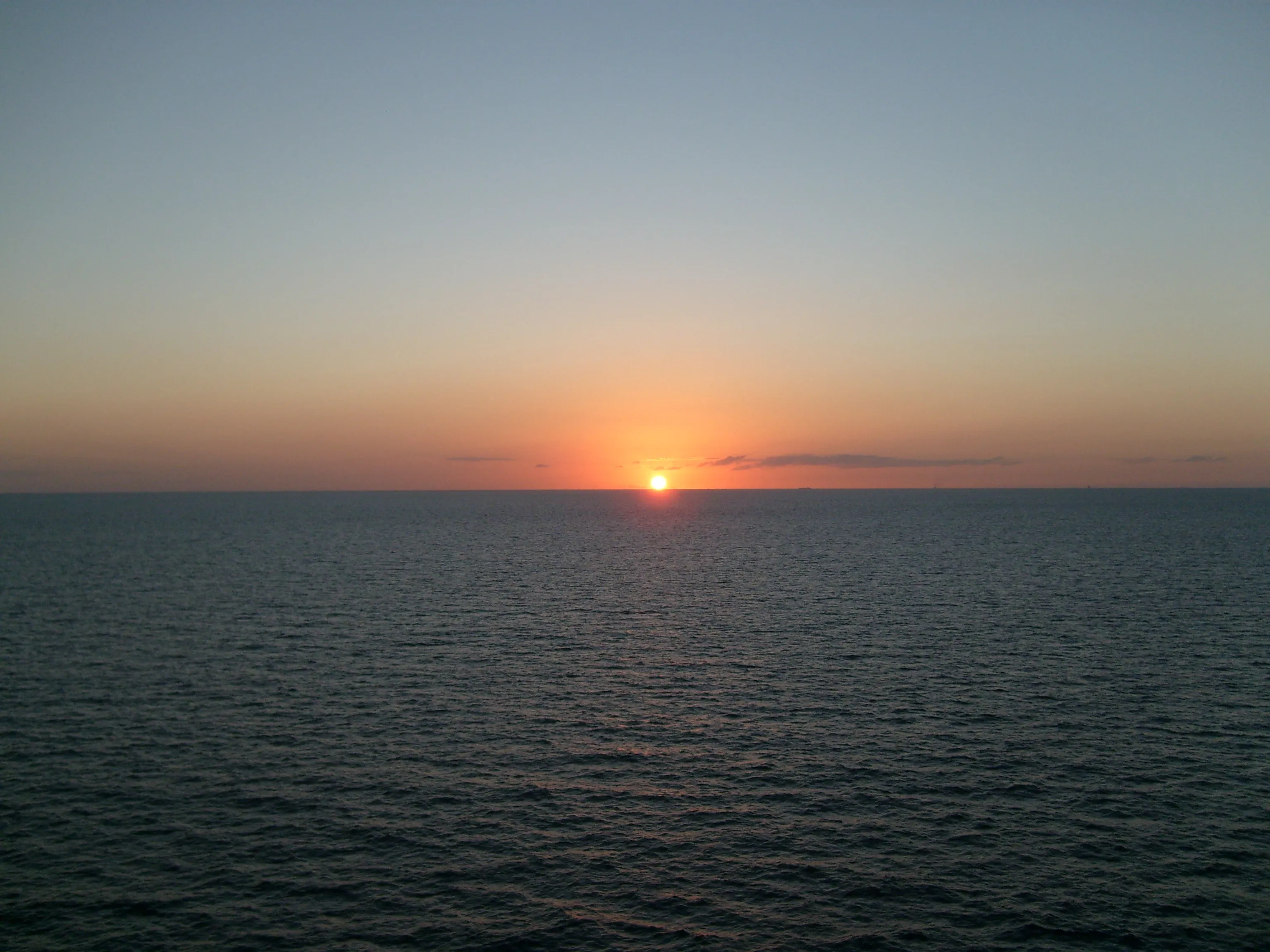 a low sunset over the ocean